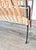Authentic Mid-Century Modern magazine rack crafted in the 1950s, featuring a timeless combination of black painted iron...