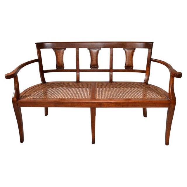 This is a McGuire attributed wooden settee with a classic, elegant design. The Fully refinished Frame of solid wood with a...
