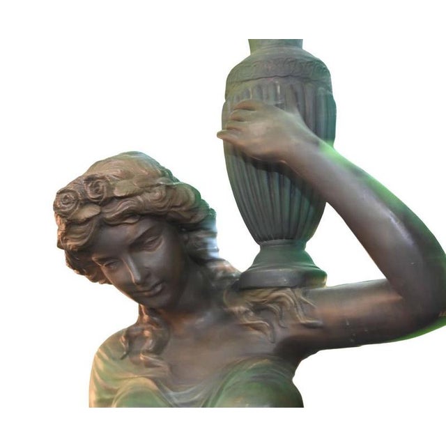Impressive pair of monumental Italian bronze statues depicting classical maidens Each female figure modelled in flowing...