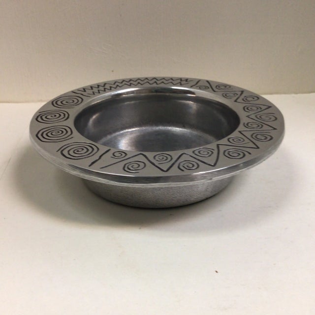 Here are a pair of polished pewter wine bottle coasters by RWP (Wilton) Columbia Pa. One has the Christian Brothers logo...