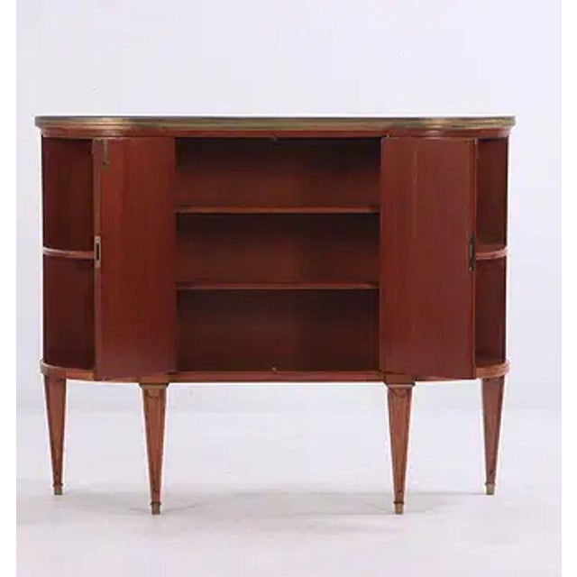 The Mid Century Jansen Style Server is a piece of furniture attributed to Maison Jansen. With its clean lines and...