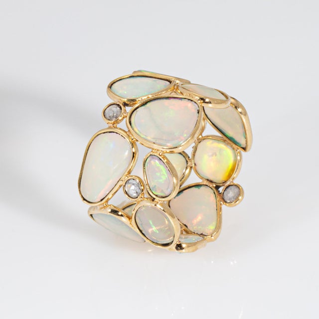 Stylish contemporary opal & diamond band crafted in 18k yellow gold. Opals range in size from approx. 6mm to 9mm. Four...