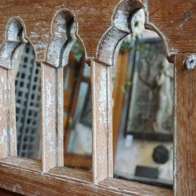 DETAILS Made from an antique architectural component this rectangular mirror features an arcaded frame. It has been fitted...