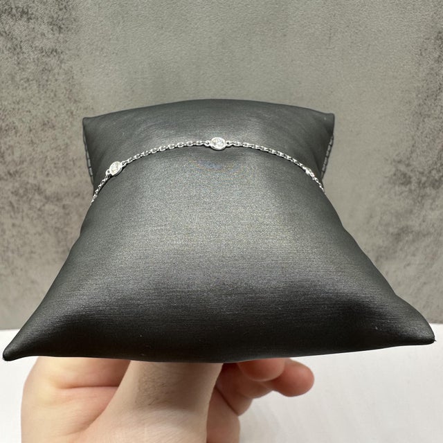 This elegant diamond station bracelet in 14kt white gold features 0.33 carats total weight of natural GH SI2–I1 round...