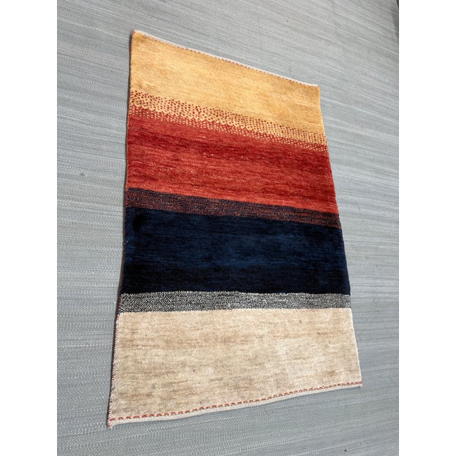 Design Plus Gallery presents a 3ft 1in × 4ft 8in Persian Gabbah Striped Area Rug, the petite rug will bring so much joy to...