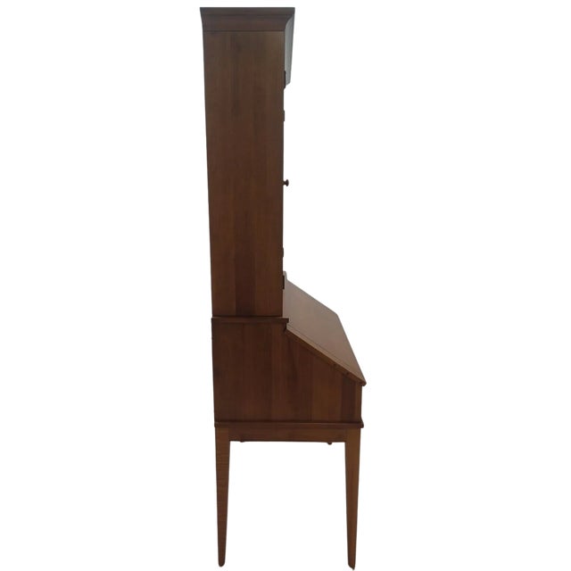 This charming Ethan Allen shaker-style secretary desk with bookcase hutch top exemplifies the refined elegance of mid-20th...