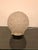 Gorgeous Art Deco table lamp with geometric motif by Sabino. Having a clear frosted geometric glass round shade. Resting...