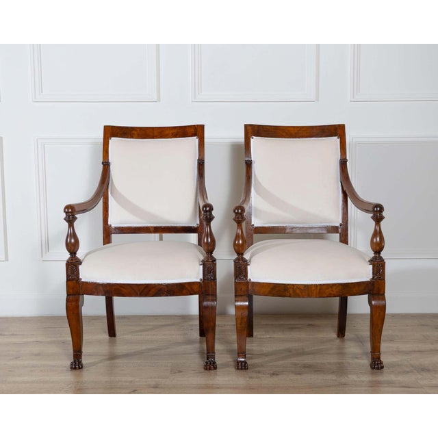 Elegant pair of 19th-century Italian Empire armchairs from Genoa, crafted in solid mahogany with refined neoclassical...