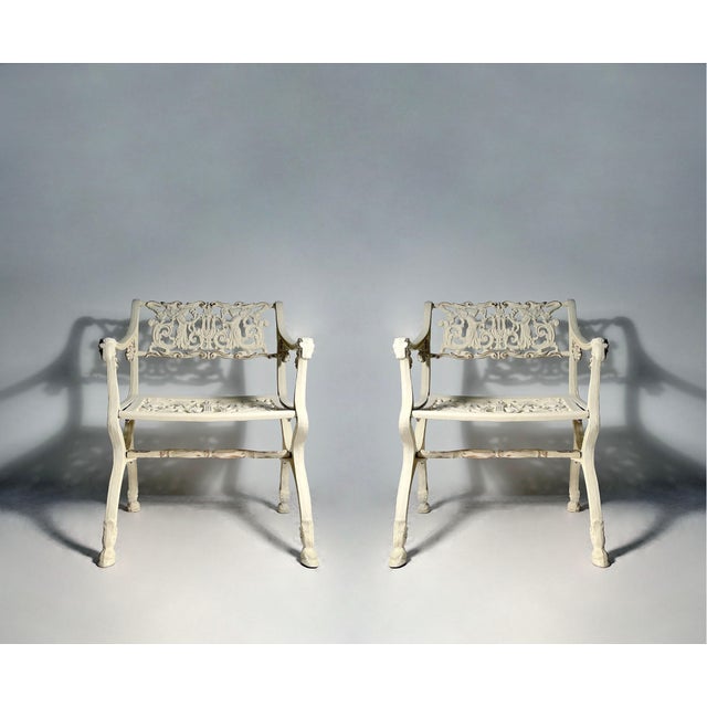 Pair of Vintage Cast Metal Chairs by Karl Freidrich Schinkel We believe these are mid to late 20th century productions....