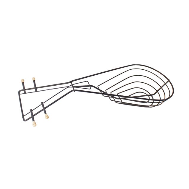 A mid-century metal lute decorative bowl in the style of Frederic Weinberg. The design features an abstract triangular...