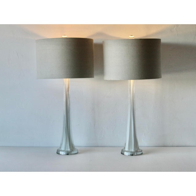Mid-century modern sculptural art glass lamps featuring white glass encased in clear glass (sommerso style) in the style...