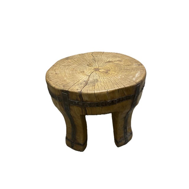 Handcrafted rustic stool carved from a single solid wood trunk, featuring beautiful natural grain, age cracks, and hand-...