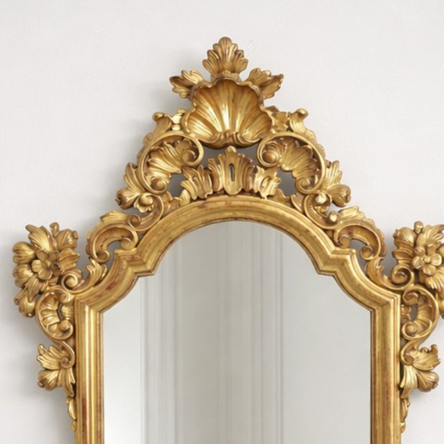 Magnificent Rococo carved wooden gilt mirror, 19th century. It maintains the essence and elegance typical of the Louis XV...