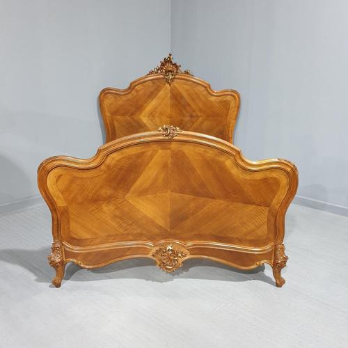 Excellent quality French walnut and parcel gilt double bed excellent condition and very crisp carvings to head, baseboard...
