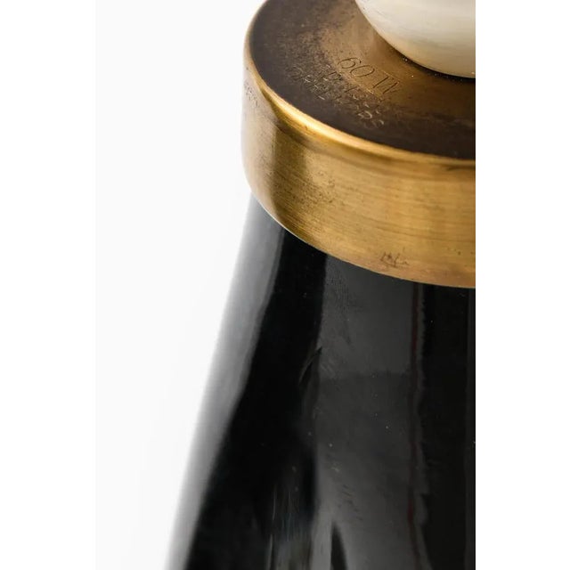 A pair of table lamps model rd-1323 designed by carl fagerlund. Produced by orrefors in sweden. This piece is attributed...