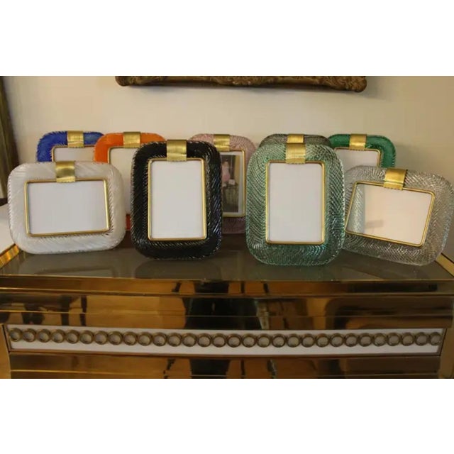 This beautiful vertical photo frame is purely in the vénitien glass manufacturing tradition.The technique uses to get this...