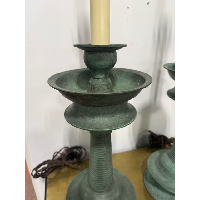 Pair Of Patinated Bronze Candlestick Lamps, Continental, Late 19th–20th C. This pair of substantial candlestick-form table...