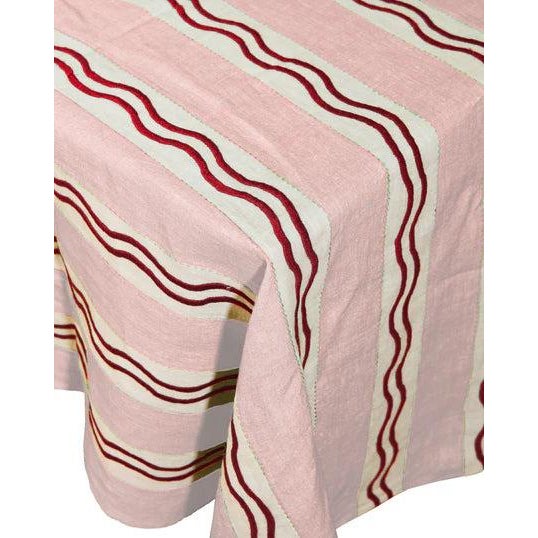 Our Monaco Stripe Tablecloth, hand-embroidered onto 100% linen in a deep, salon-room green — the stripe and squiggle...