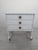 Vintage style whitewashed chest of drawers and cabinet A practical, mobile chest of drawers with drawers and shelves in a...