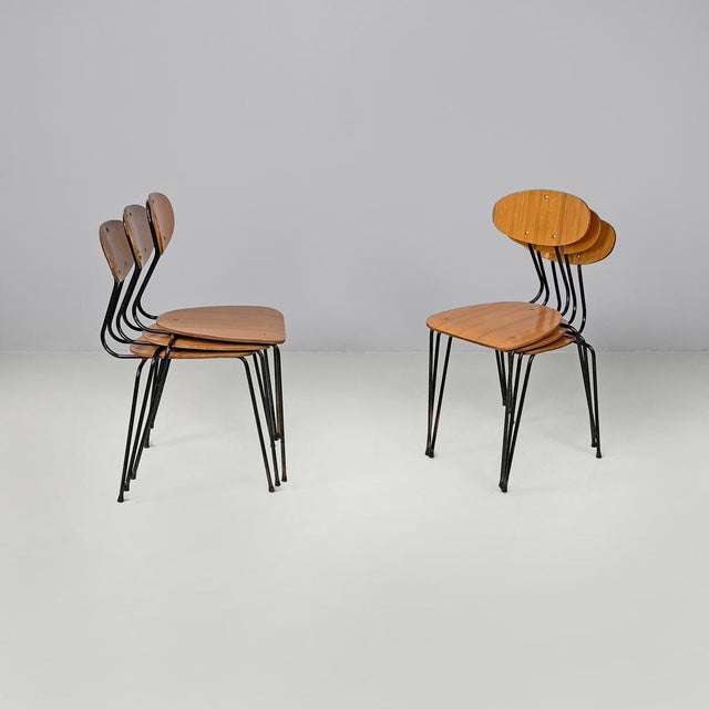 Italian mid-century modern chair in brown formica and black metal, 1960s Set of six brown formica chairs with decorations...