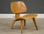 A mid century modern early example oak LCW lounge chair designed by Charles and Ray Eames for Herman Miller. Circa 1951....