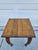 A vintage, possibly antique oak plant stand or small side table. This piece features warm oak woodgrain and slender...