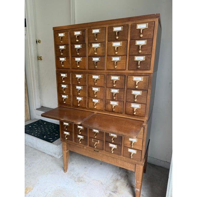 A rare and exceptional Mid-Century Modern 40-drawer library card catalog with 45 drawer Dimensions are 33" W x 58" H x 17'...