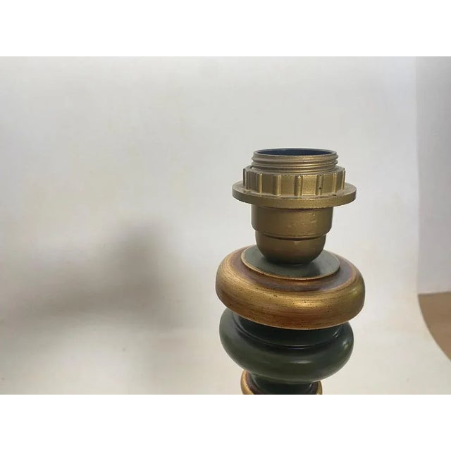 Wood table lamp. It has been made in France Circa 1970 Green color. Up to 250V (Europe/UK Standard).The wiring of this...