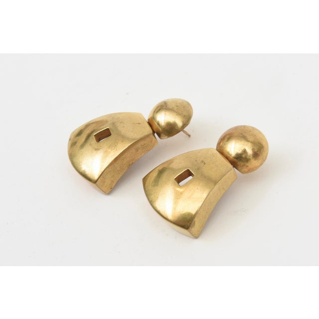This pair of vintage gold plated pierced dangle earrings by Steven Vaubel are signed. They are sculptural and now au...