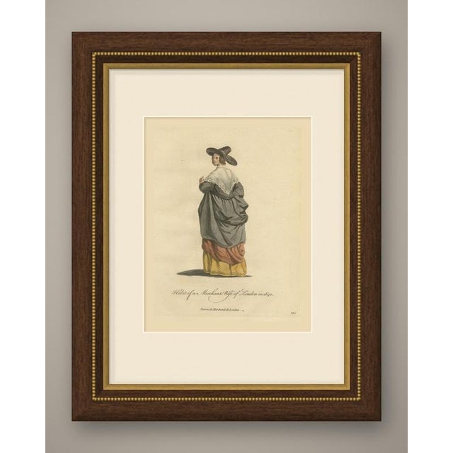 This is an original antique copper engraving from 1757, colored by hand, lettered "Habit of a Merchants Wife of London in...