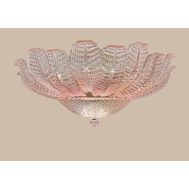 DUTIES FREE A striking and rare ceiling lamp crafted in Murano, Italy, featuring an extraordinary floral design composed...