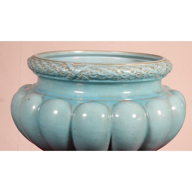 Superb late 19th-century celadon blue glazed ceramic planter. The body is decorated with fluting, and the rim and base...