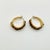 A pair of pierced gold tone hoop earrings from the 1980s. They are enhanced with small marquise shaped Baltic Amber...