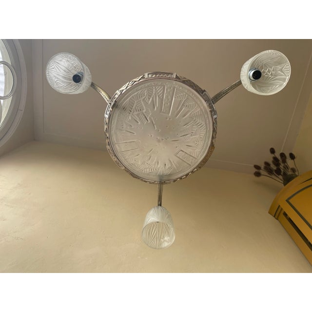 A stunning art deco pendant lamp from 1930, signed by muller freres luneville from france. the lamp features three...