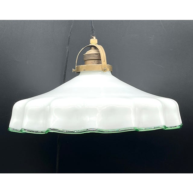 This decorative pull-out lamp with a green-accented Murano glass shade combines traditional technology with the art of...