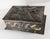 We are selling this interesting Metal jewelry box. This metal box is decorated with applique featuring Arms and Dogs with...