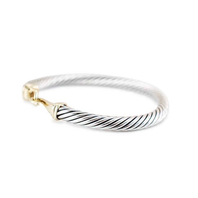 Brand: David Yurman Gender: Ladies Metal Type: 14K Yellow Gold & 925 Silver Length: 6.25 inches Width: 5.00 mm Weight:...