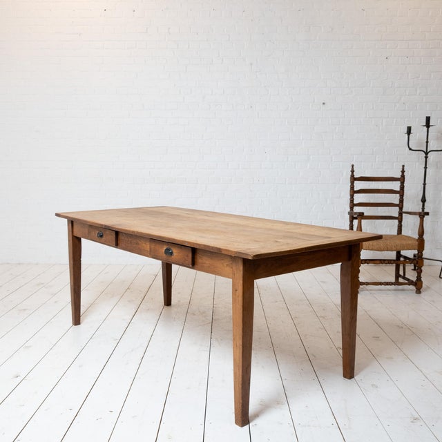 Antique oak farmhouse table, late 19th century. Original patina preserved. Two drawers. Height under the apron: 64 cm....