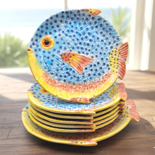 A vintage set of hand-painted Italian majolica fish plates with matching serving platter by Zanolli, produced in northern...