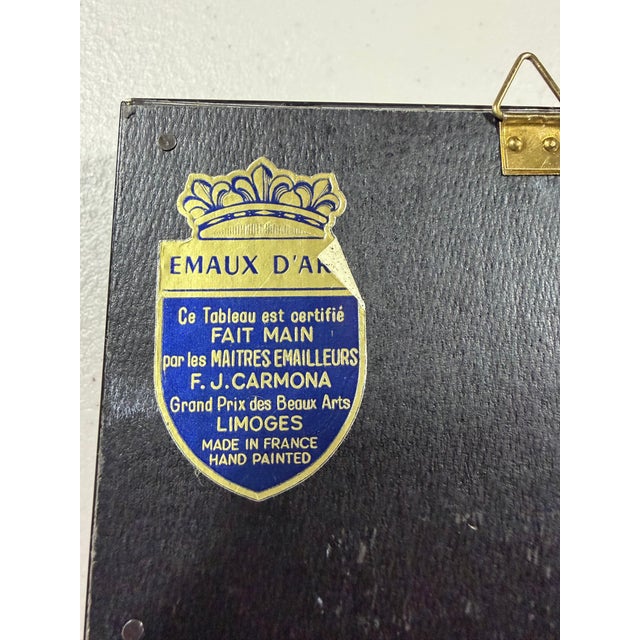 This item is a collectible F.J. Carmona Limoges enamel plaque, a decorative piece handcrafted by master enamelers in...