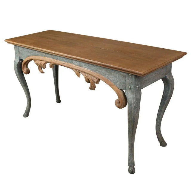 This William Yeoward Painted Console Table exudes elegance with its carved apron and unique design elements. Standing at...