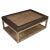 A modern rectangular two tiered coffee table of gray stained wood and brown leather trim detail