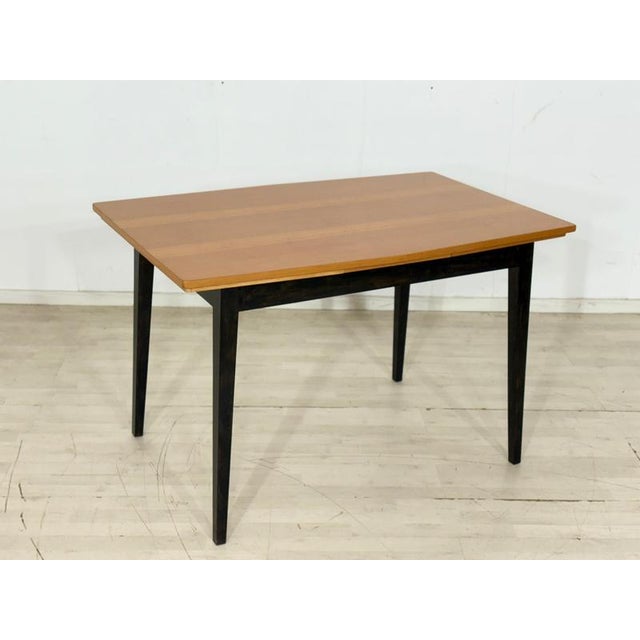 This beautiful vintage dining table from the 1960s is in excellent, very well-maintained condition. The tabletop features...