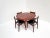 A stunning mid-century Danish dining set featuring six rare rosewood dining chairs designed by Schiønning & Elgaard for...
