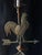 Wonderful vintage brass table lamp featuring a dimensional rooster weathervane with arrow and directional compass details....