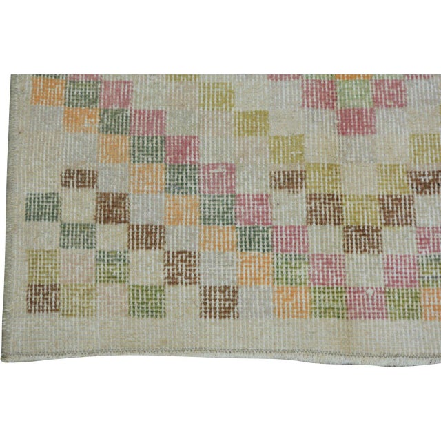 Hand-knotted with care using traditional rug-making techniques, this wool rug blends timeless craftsmanship with a modern...