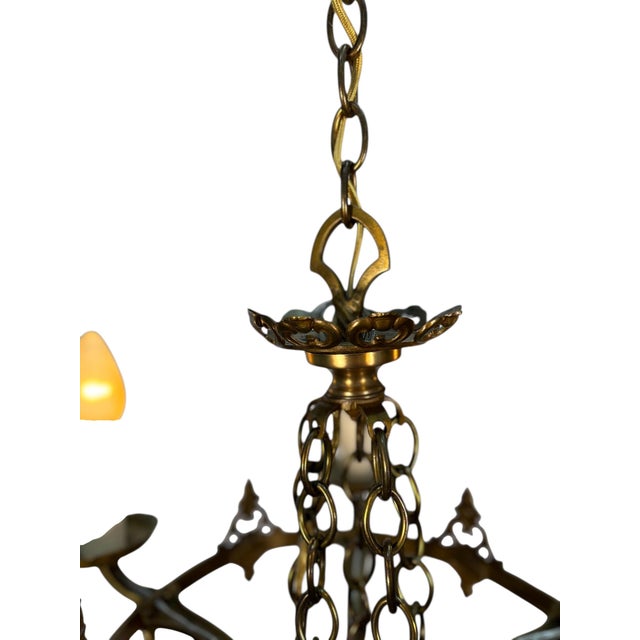 Nicely cast in solid brass, this 5 light chandelier has its original finish and all new wiring. We have it a good cleaning...