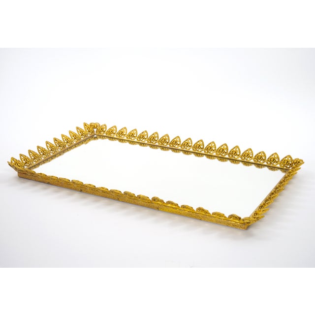 This elegant rectangular vanity or serving tray, dating to the 1970s, combines a luminous mirrored surface with a finely...