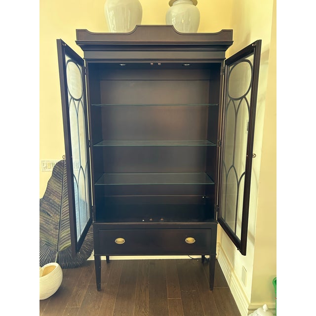 An exceptional display cabinet from the renowned Winterthur Collection by Hickory Chair, the “Bella” cabinet embodies...