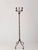 Elegant vintage brass coat rack featuring distinctive shield-shaped hooks, a beautifully twisted column, and a decorative...